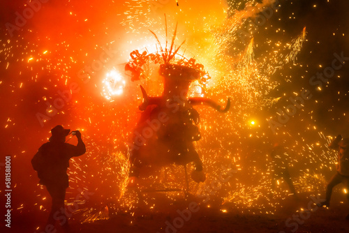 A handmade bull in the middle of a firecrackers burst in an annual celebration in Tultepec, Mexico.