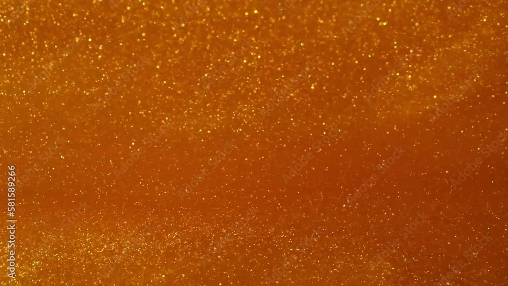 Falling Gold Glitter Dust Particles abstract background. Floating gold