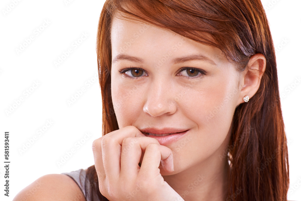 Just being herself. Cropped closeup portrait of a pretty redhead against a white background. Just being herself. Cropped closeup portrait of a pretty redhead against a white background.