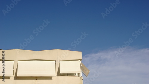 white building facade against blue sky