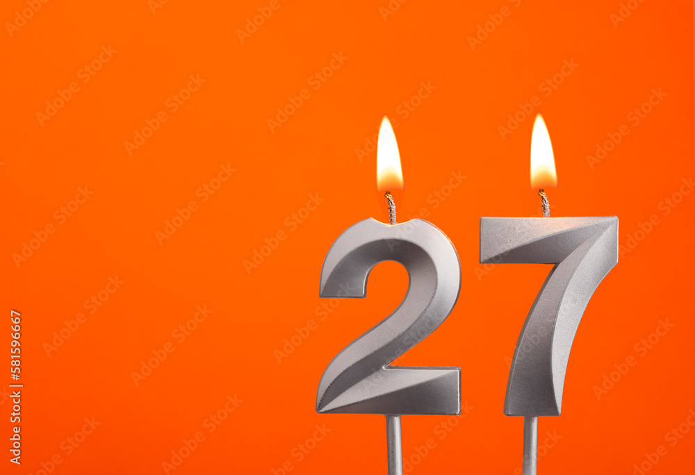 Candle number 27 - Birthday in orange background Candle number 27 - Birthday in orange background