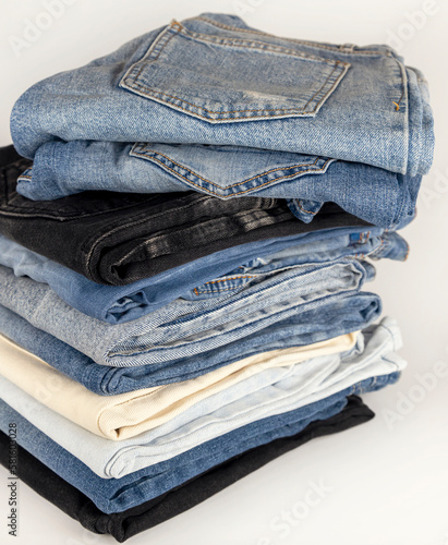Folded denim pants with pockets to the top. Beauty and fashion clothing concept