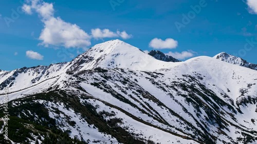 Time lapse of snowy mountain tops in Polish western tatra mountains