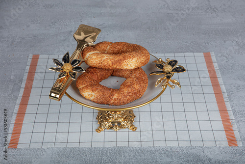 Sesame bagel. Turkish pastry product. Sesame bagel on a dark background. Close-up. local name susamli simit photo