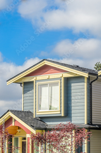 The roof of the house with nice window.