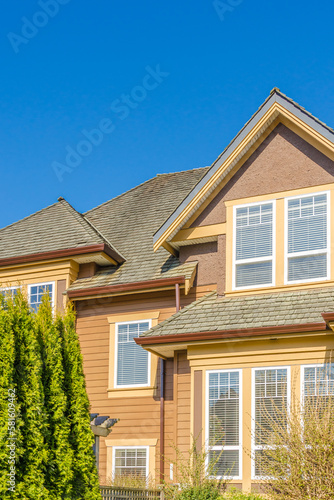 The roof of the house with nice window.