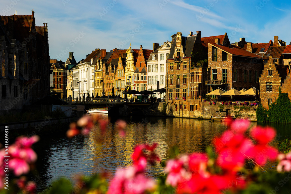 Medieval buildings in historical center of Ghent reflecting in water of river Leie Flanders, Belgium