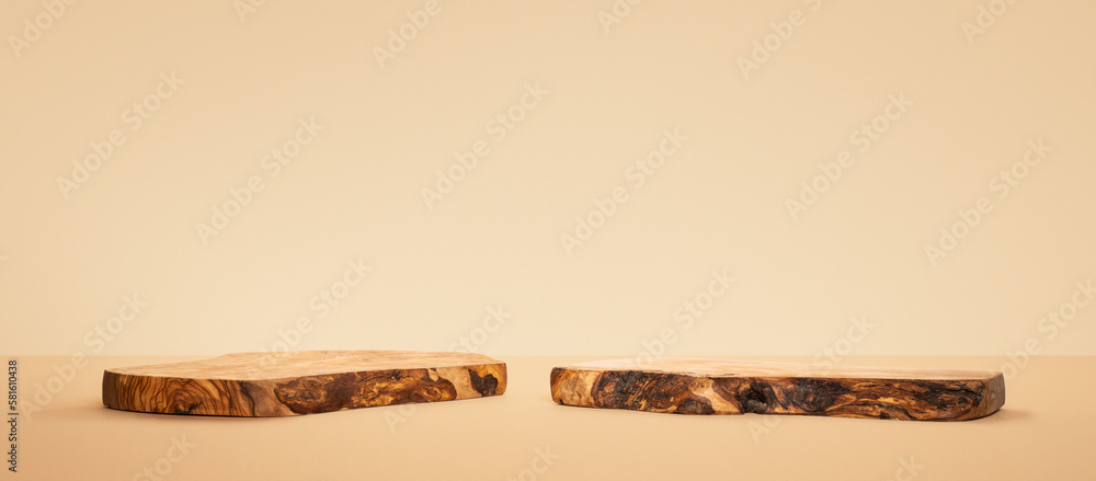 Two wood podiums for food, cosmetic products, perfumes against beige background. Product presentation. Front view.
Two wood podiums for food, cosmetic products, perfumes against beige background. Product presentation. Front view.