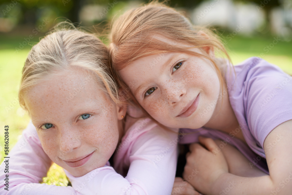 Were best friends. Two little girls lying happily on the grass. Were best friends. Two little girls lying happily on the grass.