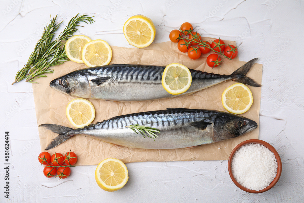 Flat lay composition with tasty raw mackerel on white textured table Flat lay composition with tasty raw mackerel on white textured table