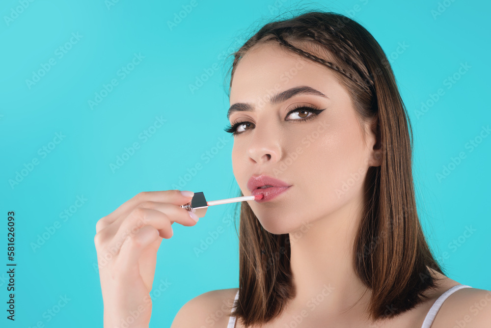 Sexy woman with lipstick. Photo of sensual girl with perfect makeup and plump lips on studio background. Beauty concept. Colored lipstick. Beauty and cosmetics concept. Lips correction. Sexy woman with lipstick. Photo of sensual girl with perfect makeup and plump lips on studio background. Beauty concept. Colored lipstick. Beauty and cosmetics concept. Lips correction.