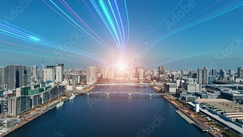 Modern city aerial view and light ray to the future concept. Communication network. Drone point of view. photo