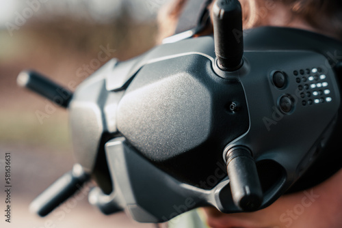 close up of a person using the fpv goggles for a dji drone