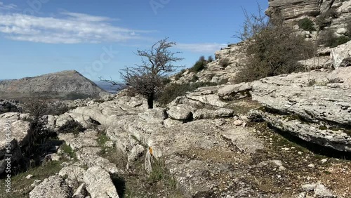 Brief tour through a mountainous area of ​​rocky paths through the karstic landscape in El Torcal de Antequera, Spain.