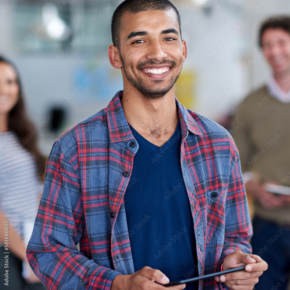 I know I belong here. Cropped portrait of a young man with colleagues in the background. I know I belong here. Cropped portrait of a young man with colleagues in the background.