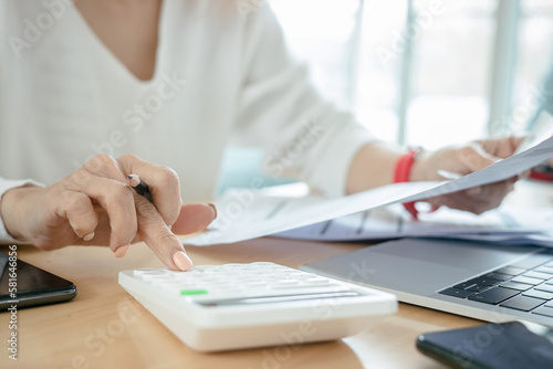 Woman checking credit card billing information