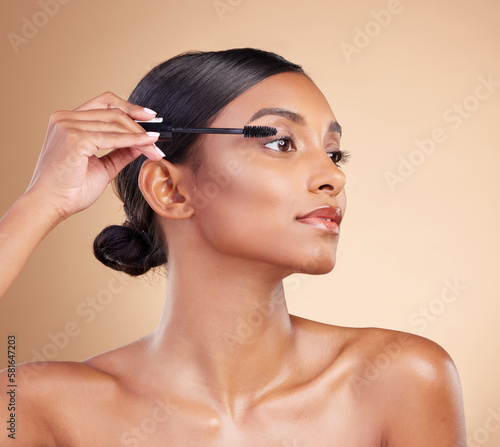 Fotografie Makeup, product and woman with mascara for eyelashes isolated on a studio background
