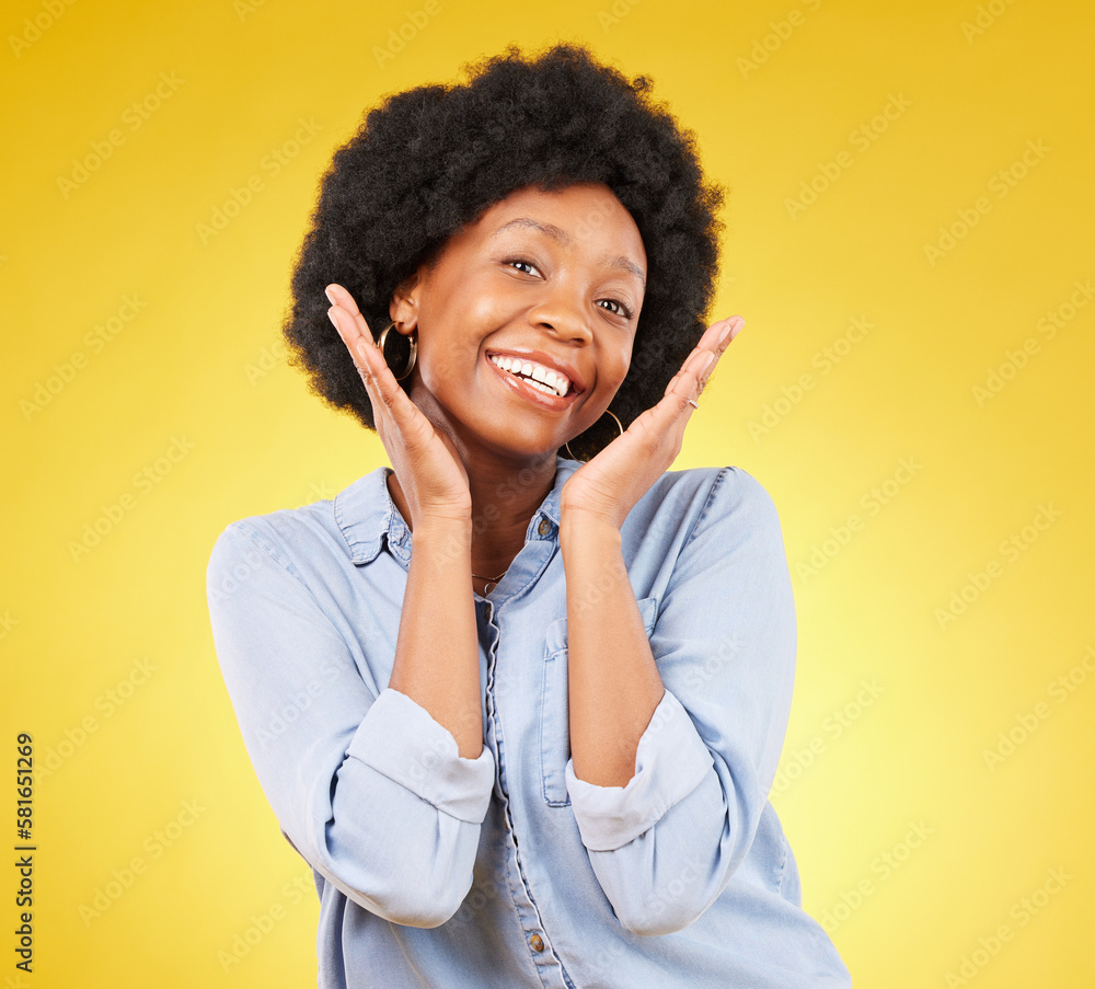 Black woman, hands on face and smile portrait in studio while excited on yellow background. African female model with afro, beauty and happiness on color space with motivation and positive mindset Black woman, hands on face and smile portrait in studio while excited on yellow background. African female model with afro, beauty and happiness on color space with motivation and positive mindset
