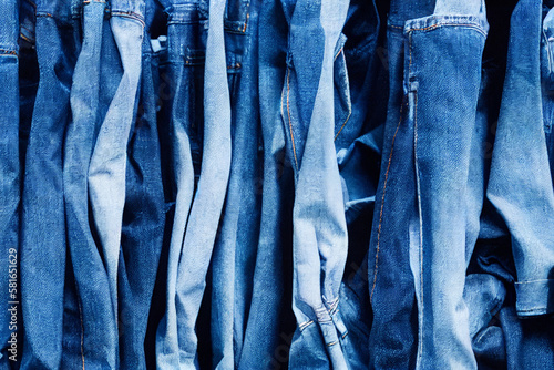 A pile of blue jeans with the word denim on it . Generative ai