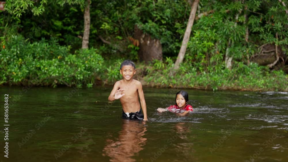 Boy Waving And Jumps Backwards Into Water Boy Waving And Jumps Backwards Into Water