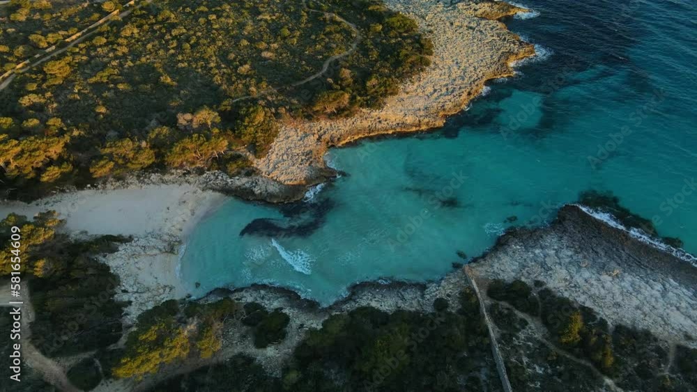Cinematic zoom in from aerial drone shot to white sand beach of Es talaier in Spain. Cinematic zoom in from aerial drone shot to white sand beach of Es talaier in Spain.