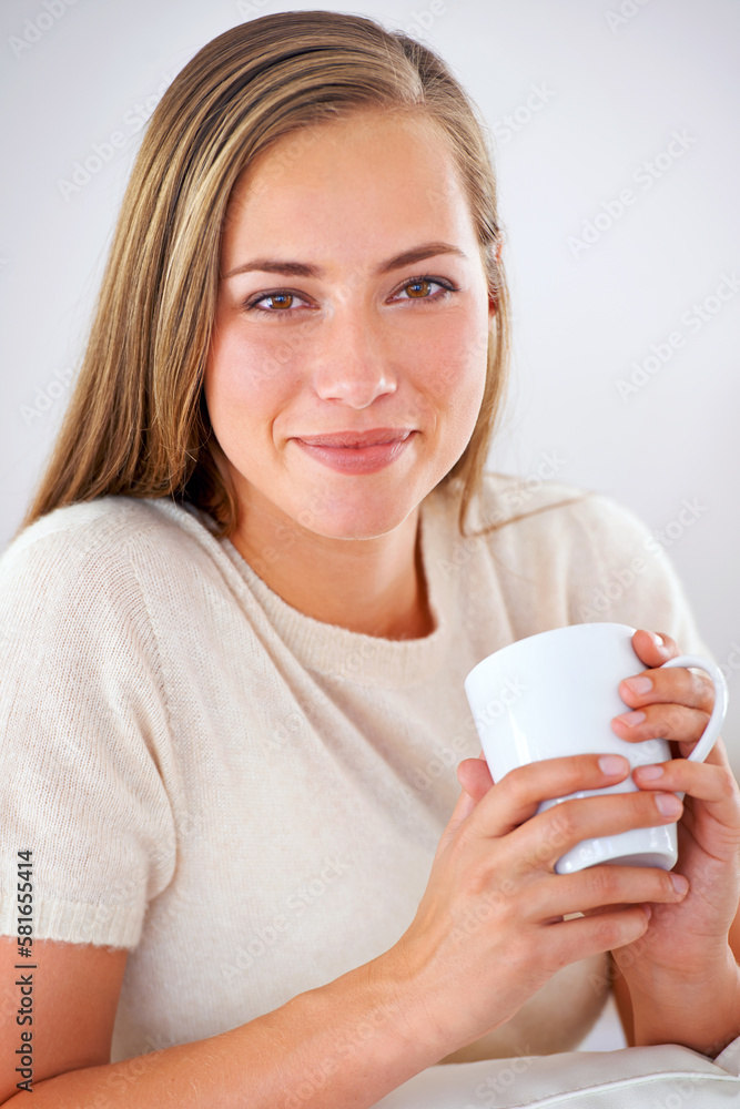 Relaxing with a fresh cuppa joe. Portrait of an attractive young woman relaxing with a cup of coffee. Relaxing with a fresh cuppa joe. Portrait of an attractive young woman relaxing with a cup of coffee.