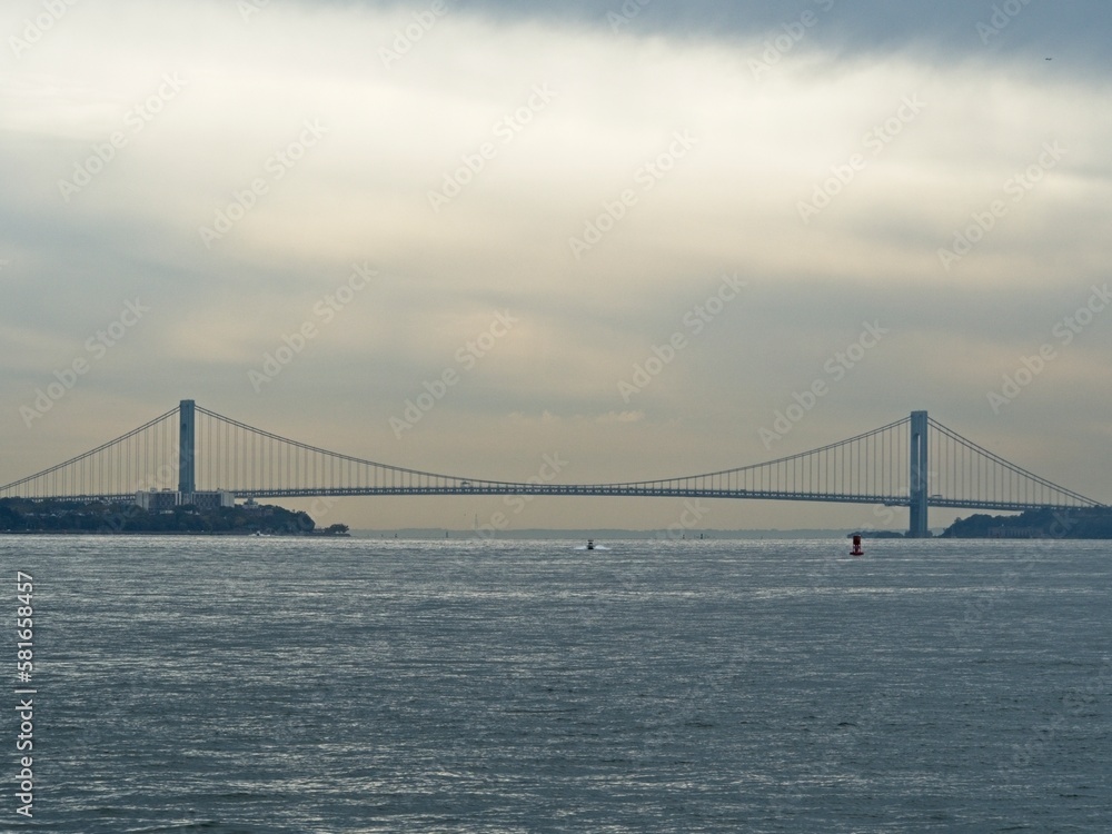 The Verrazzano-Narrows Bridge crosses the mouth of New York Harbor between the boroughs of Brooklyn and Staten Island The Verrazzano-Narrows Bridge crosses the mouth of New York Harbor between the boroughs of Brooklyn and Staten Island