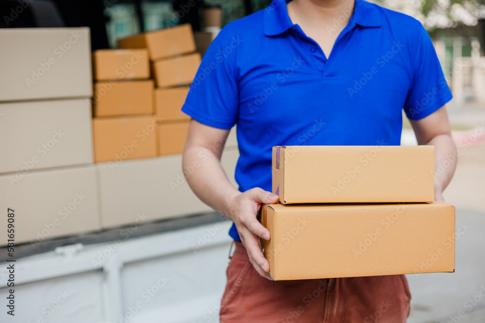 delivery concept Asian male customer receiving boxes from professional courier at home. delivery concept Asian male customer receiving boxes from professional courier at home.
