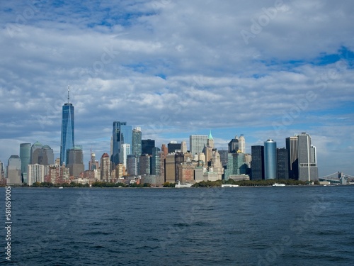 Looking back on Manhattan from the Hudson River and Liberty Island  as the towering high rises of Lower Manhattan loom above the river