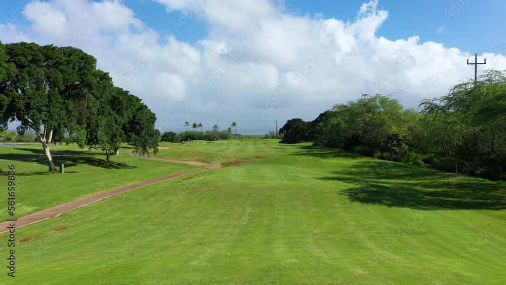 Golfer drives a straight shot in the golf course-Aerial shot-4K Golfer drives a straight shot in the golf course-Aerial shot-4K