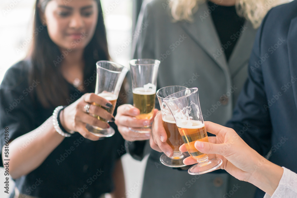 Corporate co-workers having drinks after meeting, People clinking glasses with sparkling wine indoors, Business people celebrating inside modern office.