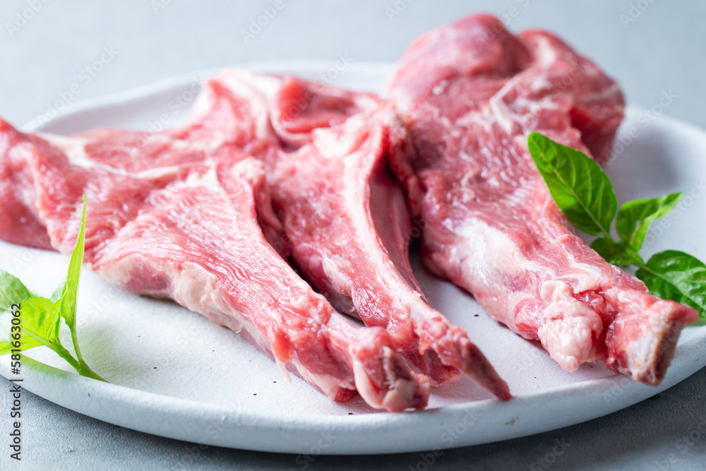 Raw lamb ribs on a plate	