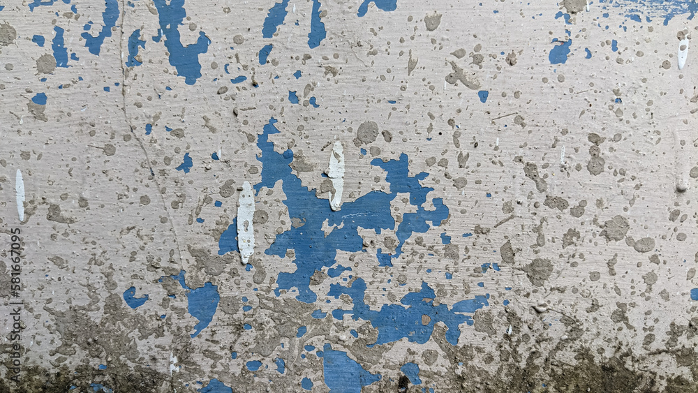 abstract texture background of an aged blue concrete wall with peeling paint