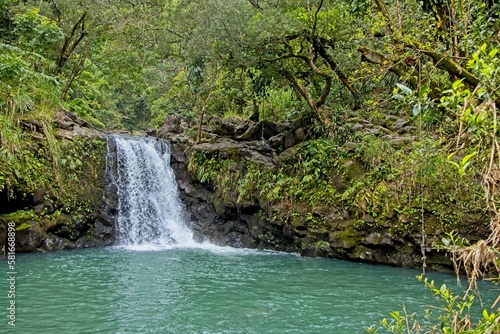 The Road to Hana is a narrow winding highway on the Hawaiian island of Maui with numerous waterfalls and other scenic sights