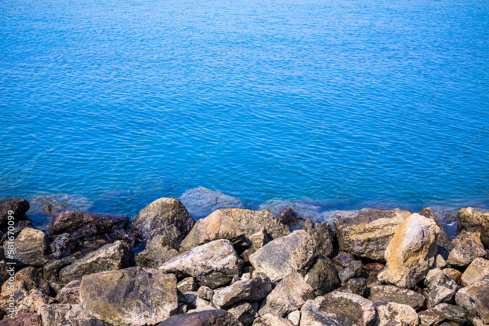The beach and sea surface with Deep Blue sea clear sky clouds. Landscape with Ocean small waves water reflection copy space for text. Illustration for tourism, website or ad. Andaman sea, Thailand. The beach and sea surface with Deep Blue sea clear sky clouds. Landscape with Ocean small waves water reflection copy space for text. Illustration for tourism, website or ad. Andaman sea, Thailand.