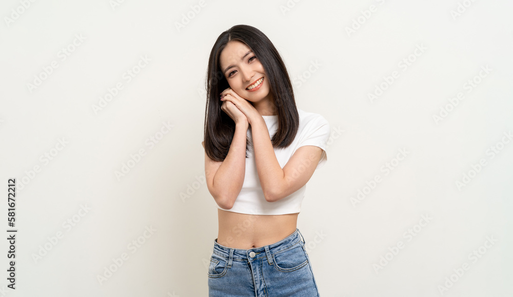 Beautiful smiling happy young asian woman age around 25 in white shirt. Charming female lady standing pose on isolated white background. Asian cute people looking camera confident with backdrop. Beautiful smiling happy young asian woman age around 25 in white shirt. Charming female lady standing pose on isolated white background. Asian cute people looking camera confident with backdrop.
