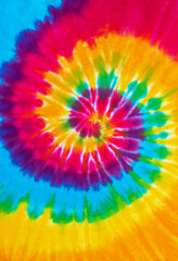 spiral tie dye pattern hand dyed on cotton fabric abstract texture background.