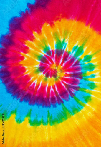 spiral tie dye pattern hand dyed on cotton fabric abstract texture background.