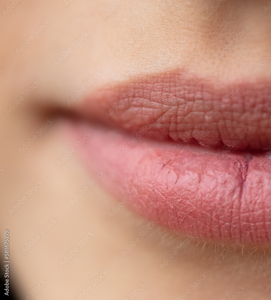 Fototapeta premium The lips of a young girl as a background.