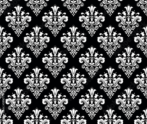 Wallpaper in the style of Baroque. Seamless vector background. White and black floral ornament. Graphic pattern for fabric, wallpaper, packaging. Ornate Damask flower ornament