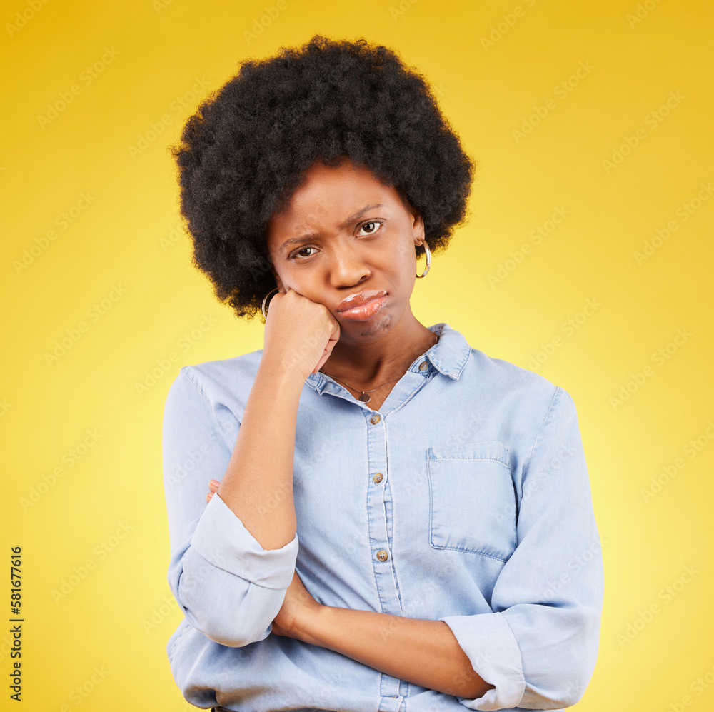 Black woman, sad face and portrait in studio upset, sulking and disappointed on a yellow background. African female model with fatigue, problem or mental health with afro hair and color space Black woman, sad face and portrait in studio upset, sulking and disappointed on a yellow background. African female model with fatigue, problem or mental health with afro hair and color space