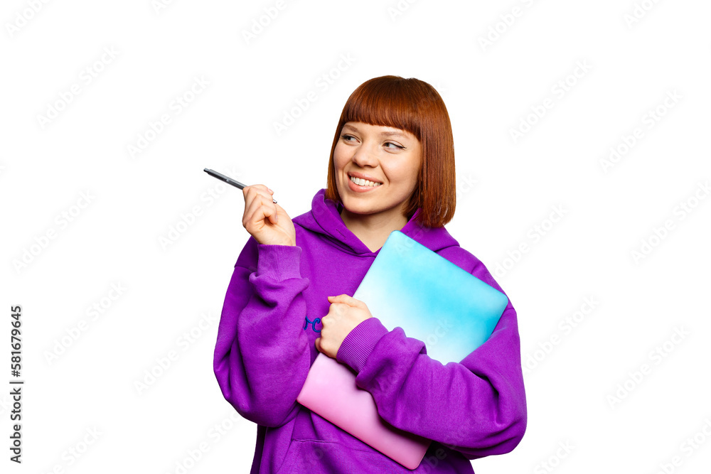 Smiling woman holding a laptop and pointing to the left Smiling woman holding a laptop and pointing to the left