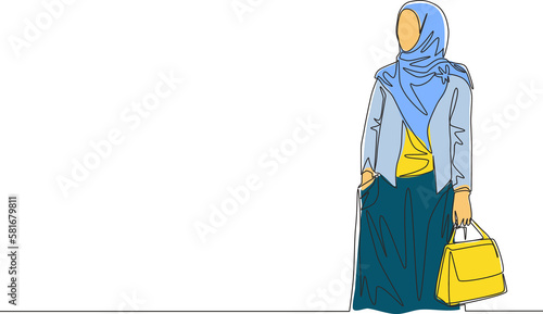 One single line drawing of young attractive happy muslimah wearing veil and holding pocket bag on hand. Beautiful woman in trendy hijab fashion concept continuous line draw design vector illustration