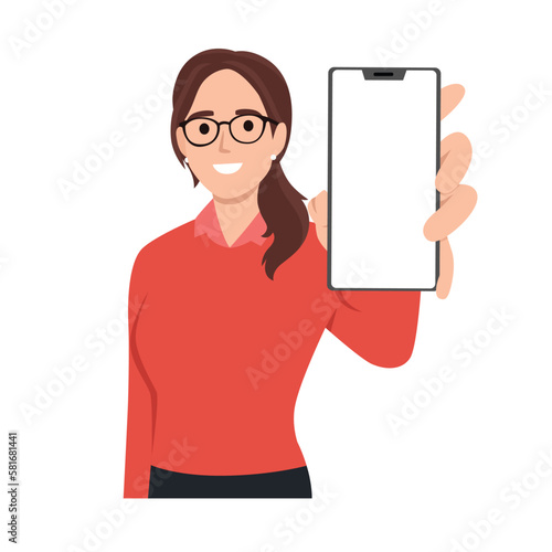 Cheerful beautiful young woman raised her hand to show blank screen in mobile phone while standing. Flat vector illustration isolated on white background