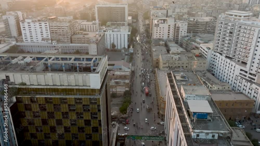 Aerial Flying Over Modern Office Building In Karachi During Sunset Light With Birds Flying Around. Dolly Forward Aerial Flying Over Modern Office Building In Karachi During Sunset Light With Birds Flying Around. Dolly Forward