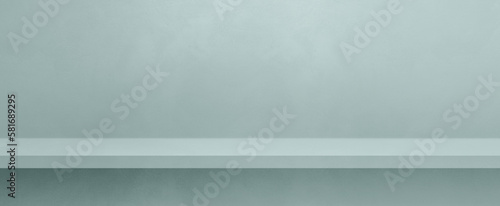 Fototapeta Naklejka Na Ścianę i Meble -  Empty shelf on a light blue concrete wall. Background template. Horizontal banner mockup