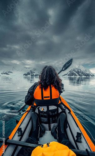 Female Kayaker Paddling Her Way Through Calm Waters of Antarctica, Woman in Orange Life Vest, Scenic Views of Arctic landscape, Vertical Orientation