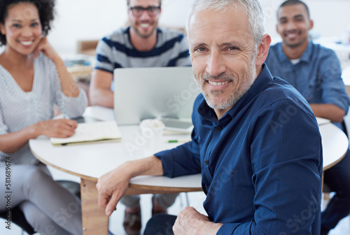 My team will ace this project. Portrait of a group of designers at work in an office.