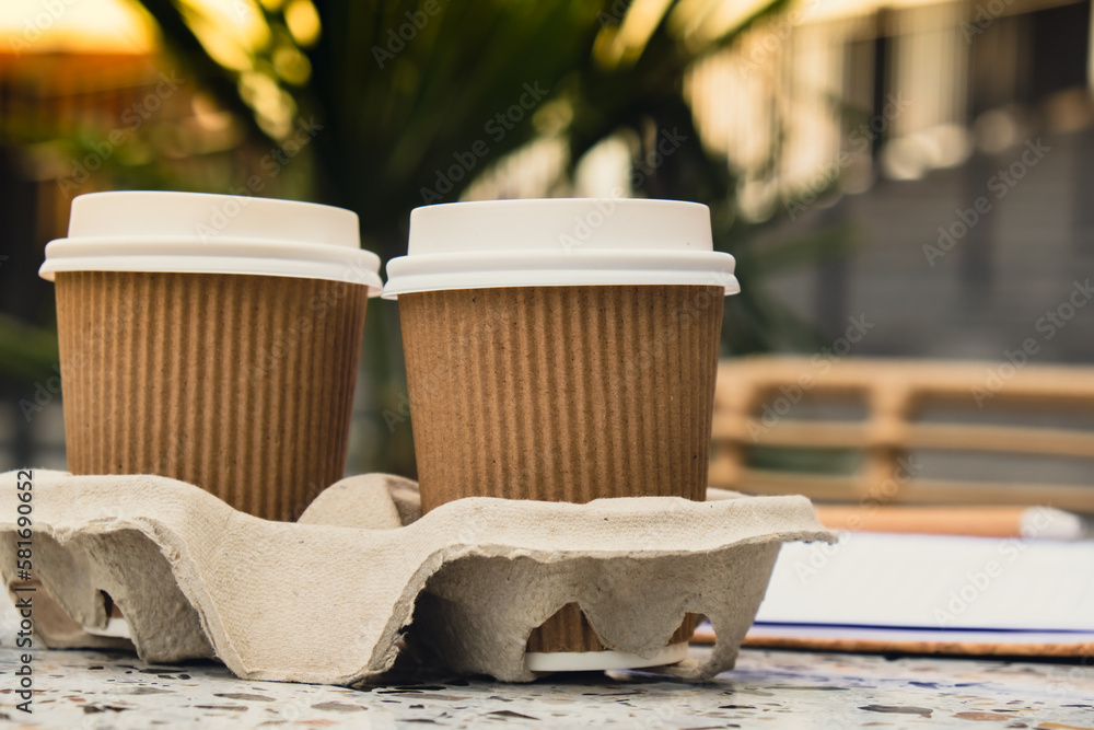 Foto de Two paper cups with lid for tea to go. Coffee take away on the