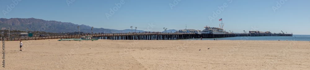 scenic pier in Santa Barbara with empty beach in